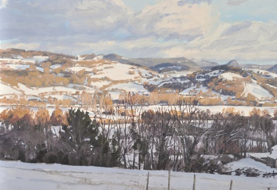 Snow on the Velay mountains, evening light