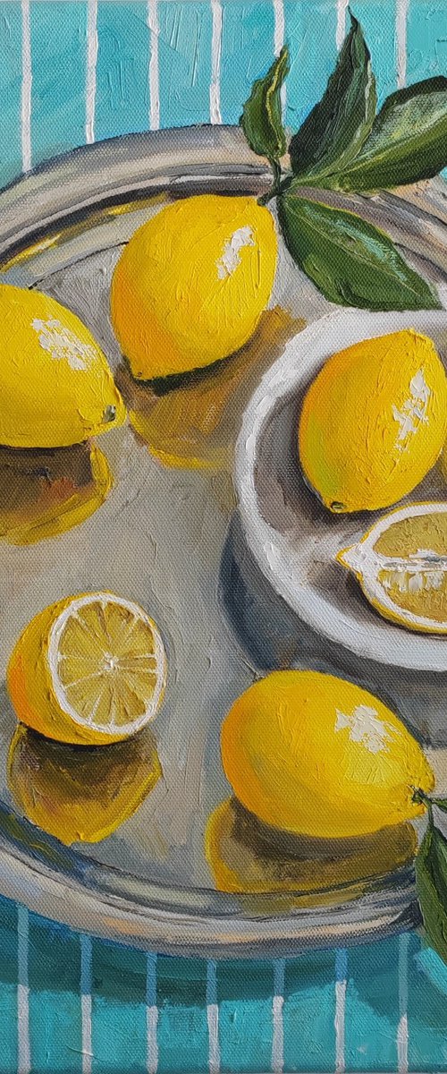 Lemons on turquoise stripen tablecloth by Leyla Demir