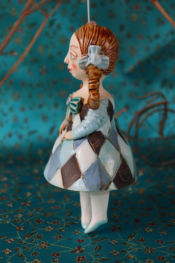 Little Girl in Blue Harlequine Dress. Tiny hanging sculpture