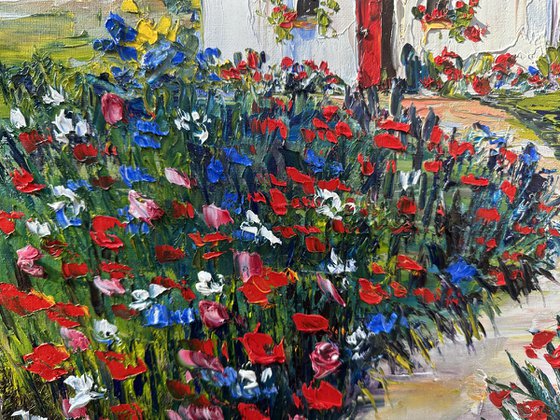 Old house with red flowers