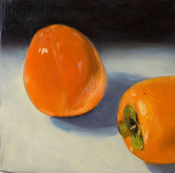 modern still life of two great persimmons
