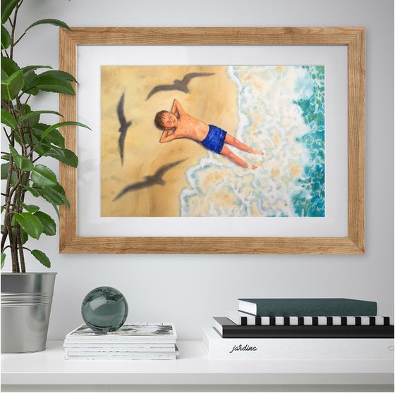 Child boy lying on sand beach