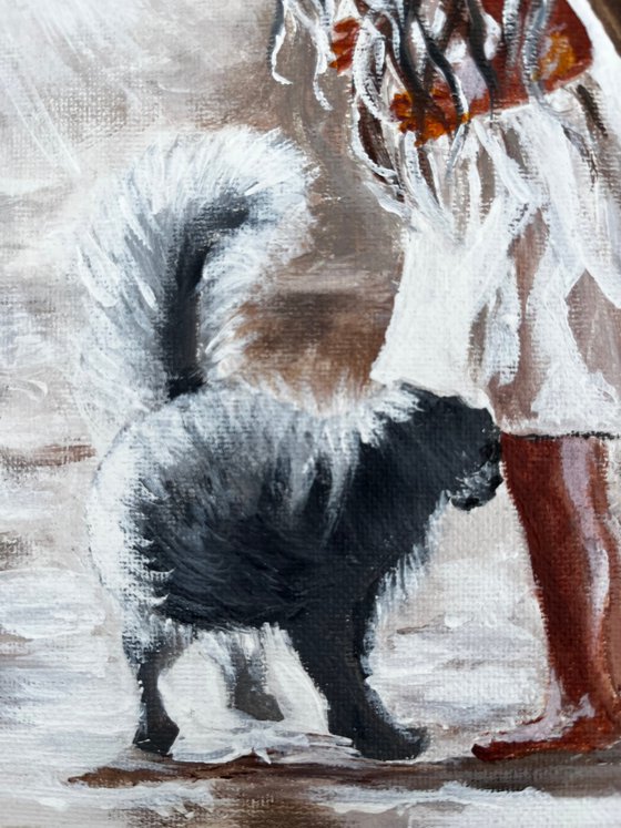 Little girl with a black cat.