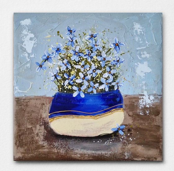 Vase with blue Flowers