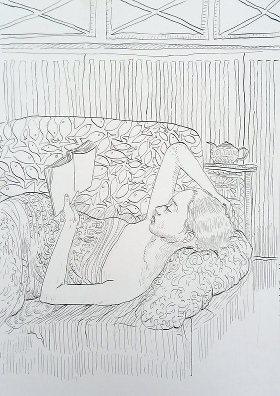 Girl reading on a sofa