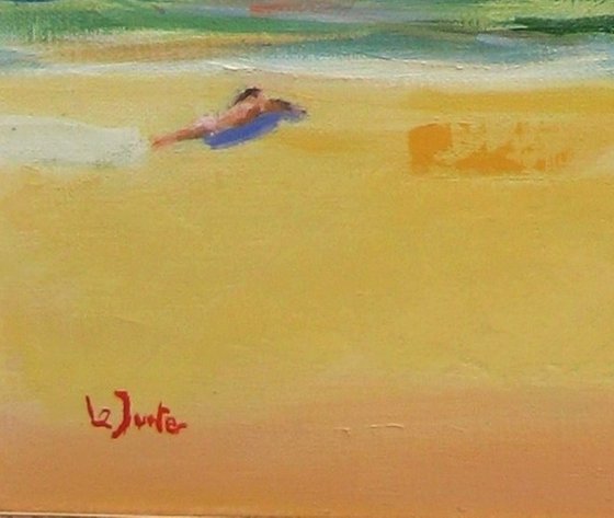 Bathers in Mediterranean cove