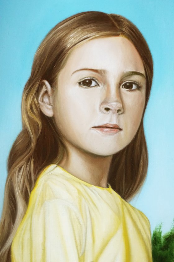Girl showing a rose bush