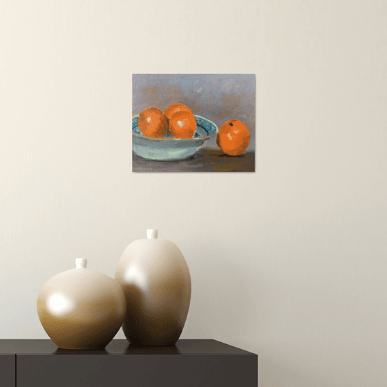 Oranges in a blue bowl. An original still life painting