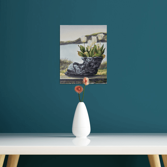 White tulips in old shoe planter sea view