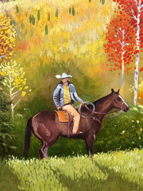 Cowboy in autumn forest