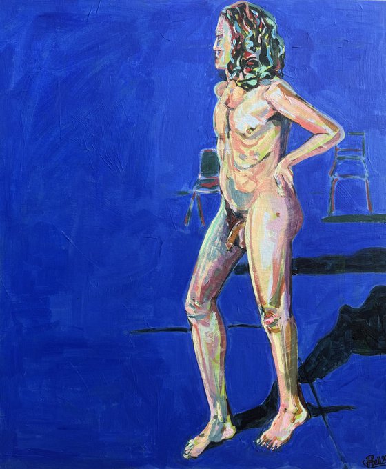 Young nude man in blue room