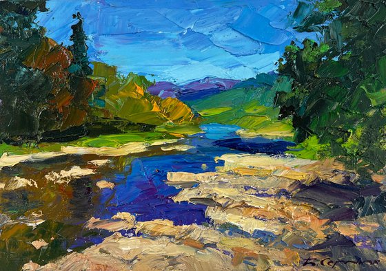 River against the Backdrop of Mountain Slopes