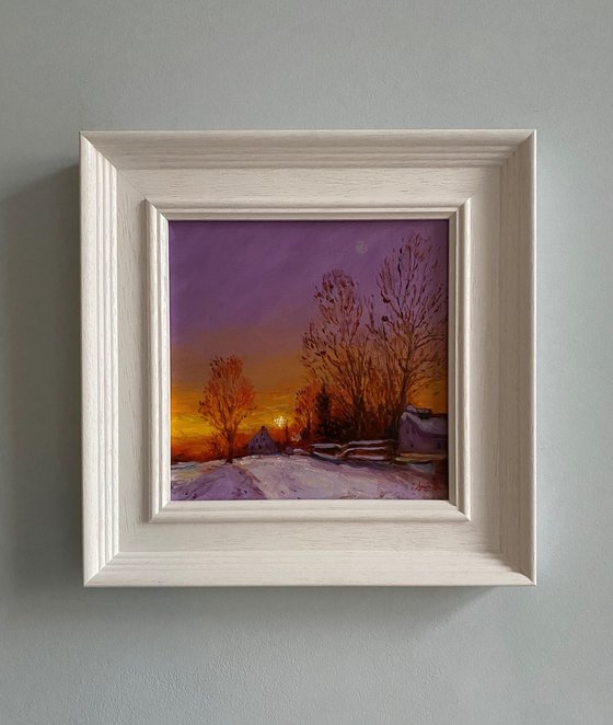 Cottages in the Winter Snow, at Sunset.