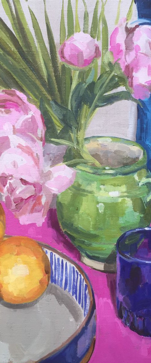 Green vase with blue glass and oranges by Katharine Rowe