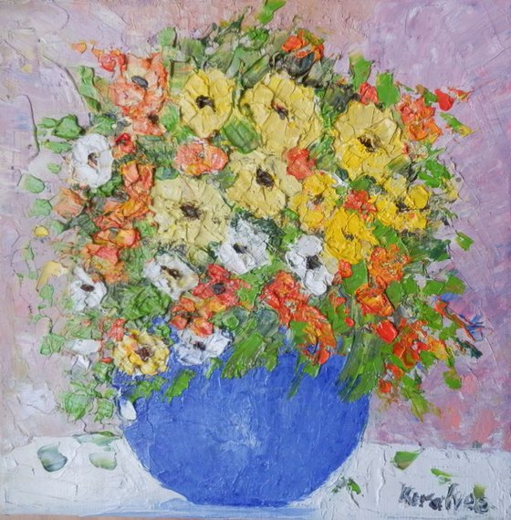 Blue bowl with multicolored flowers