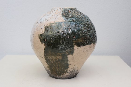 Raku and black smoked vessel.