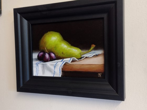 Pear on cloth still life