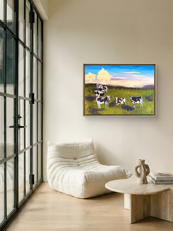 Cows grazing in the field