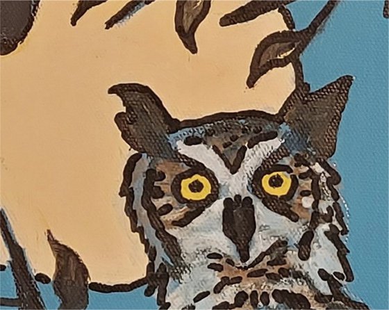 horned owl in tree