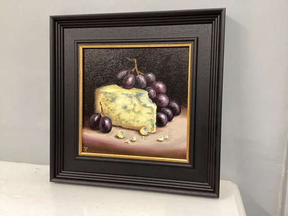 Cheese and grapes still life