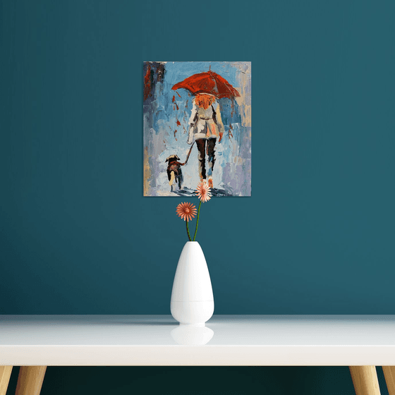 Woman with umbrella and dog.