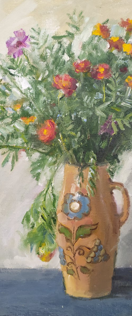 Marigolds in a ceramic pot by Valentina Andrukhova