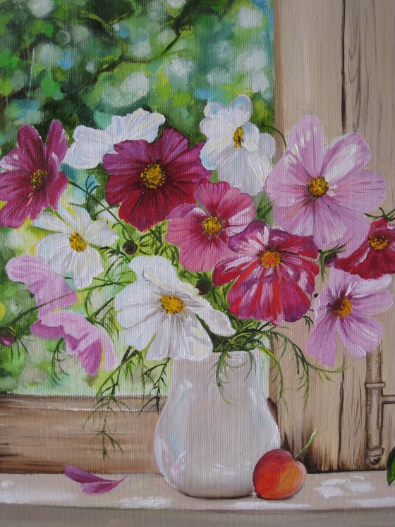 Pink Cosmos flowers in a simple white vase
