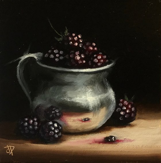 Silver cup with blackberries still life