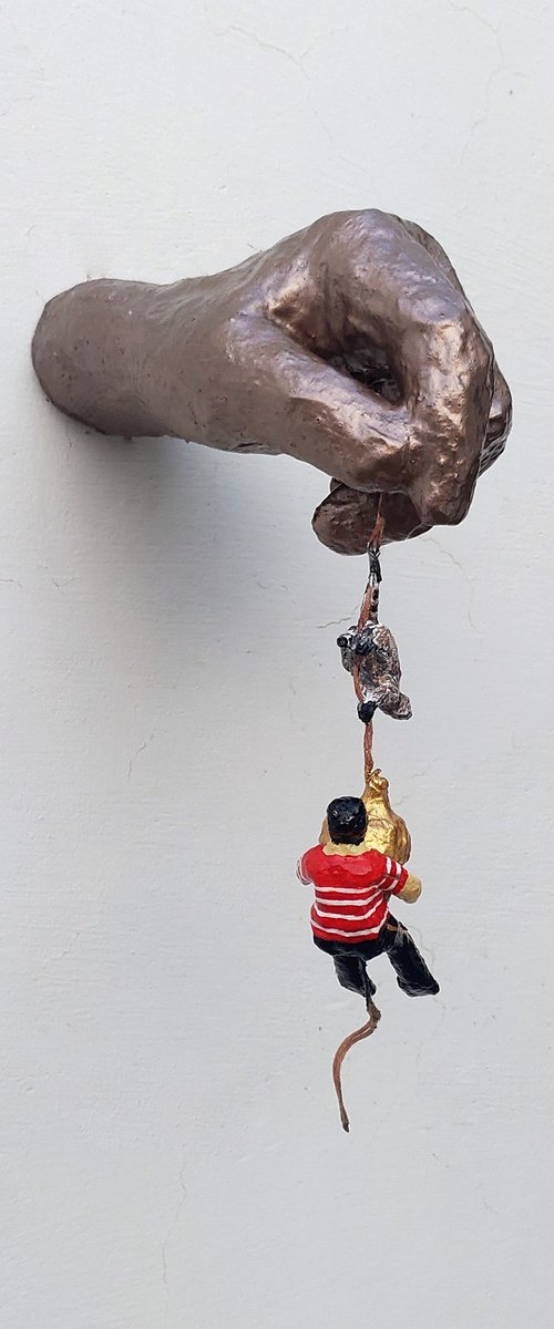 Hand holding acorn by Shweta Mahajan