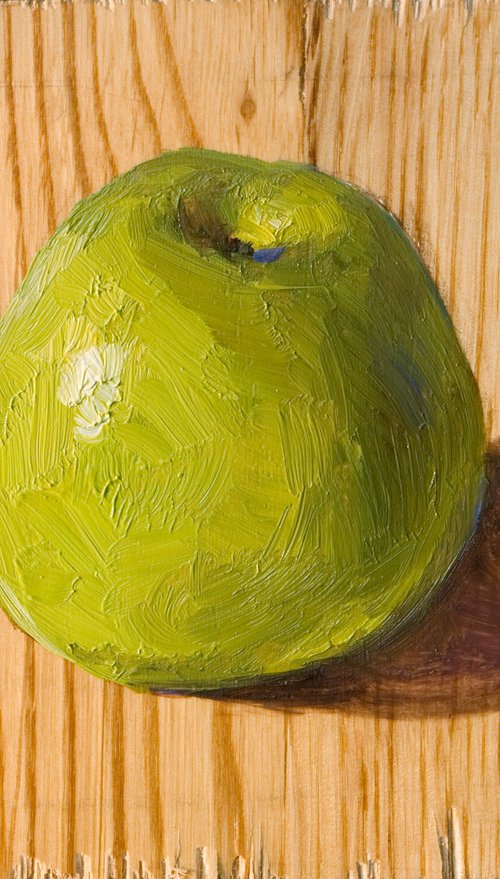 lonely apple on a wood board for food lovers by Olivier Payeur