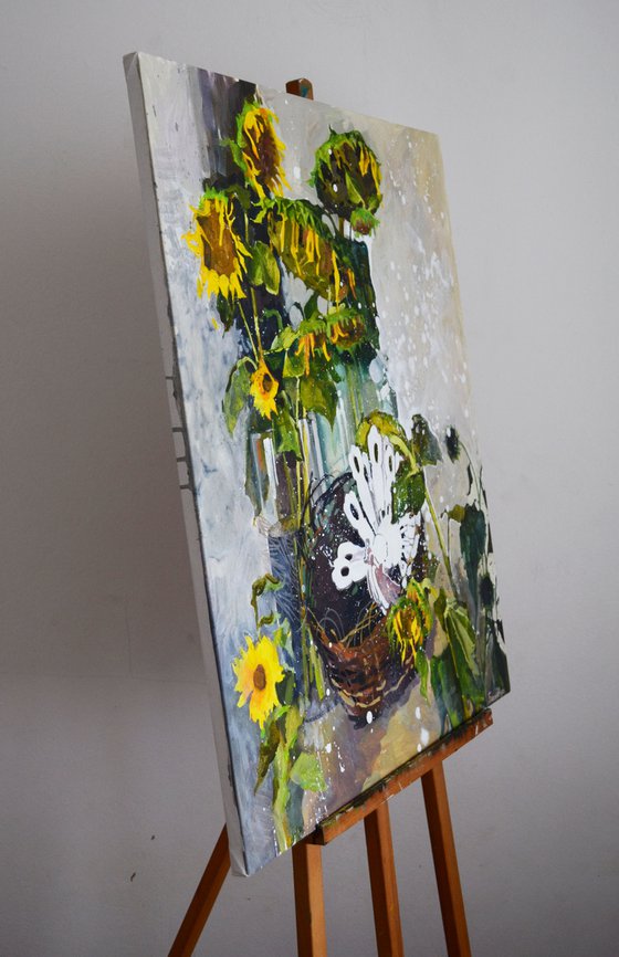 Sunflowers with wooden peacock