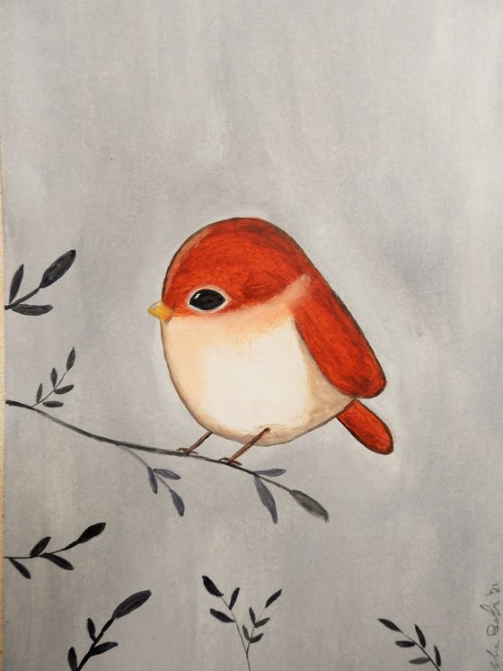 The small bird in red