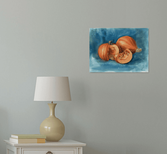 Still life with pumpkins on a blue background