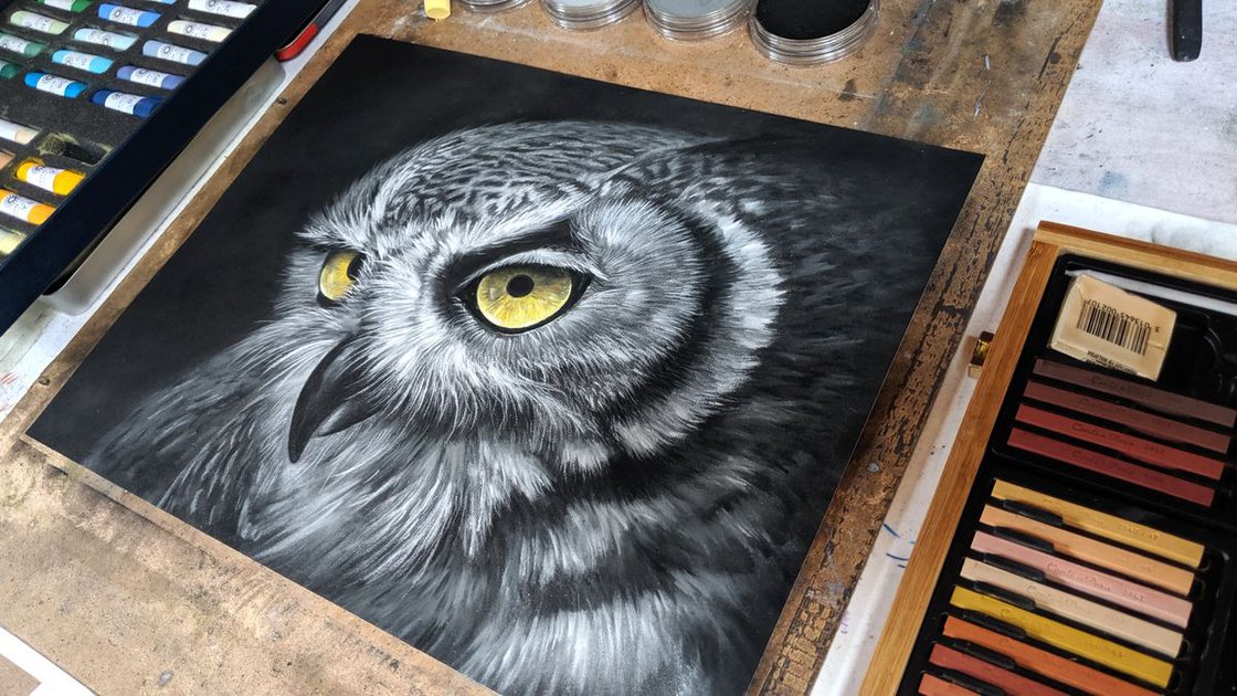 Drawing on black paper with pastel pencils, coloured pencils and other dry  media