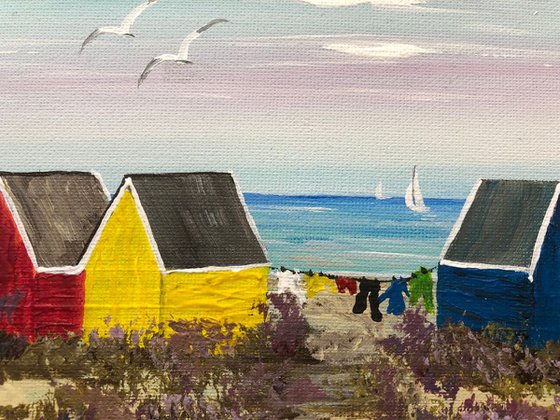 Three beach huts on the beach