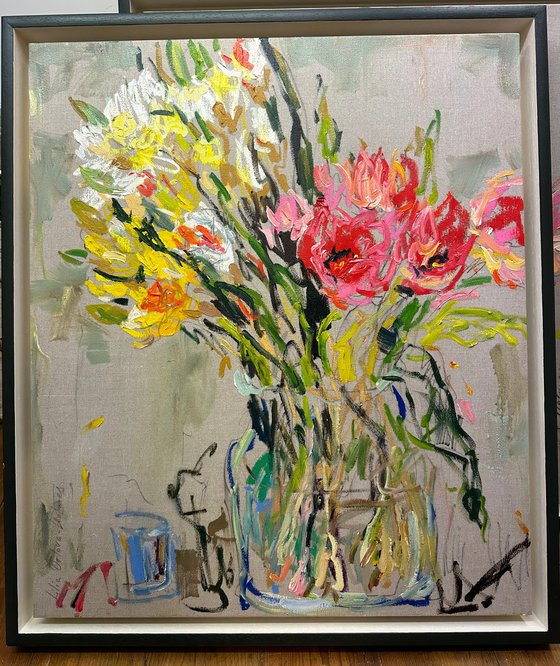 Tulips and daffodils in a glass vase