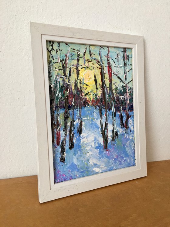 Sunset in a winter forest