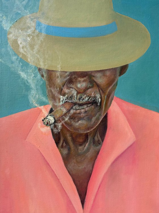 Smoking man in a hat