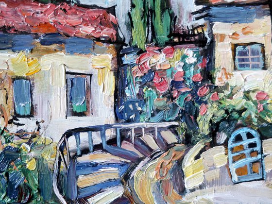 Street and rose bush.