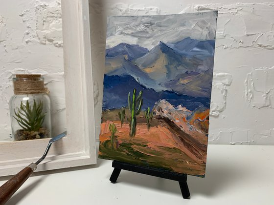 Mountains and cacti.