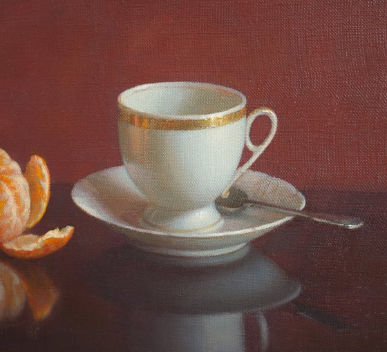 Cup of coffee and tangerine