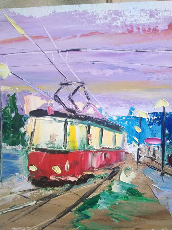 Streetcars in the evening city. Pleinair painting