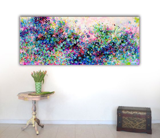 Forget me not flower field at sunrise