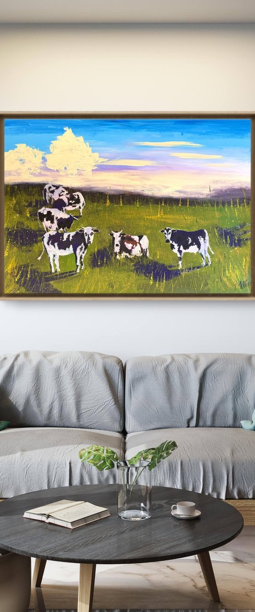 Cows grazing in the field by Yuliia Sharapova