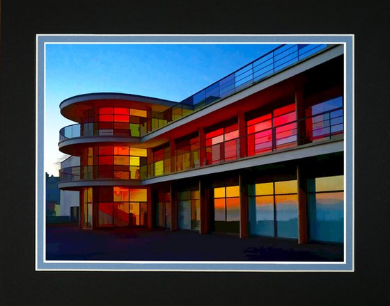 Modernist building illuminated at sunset