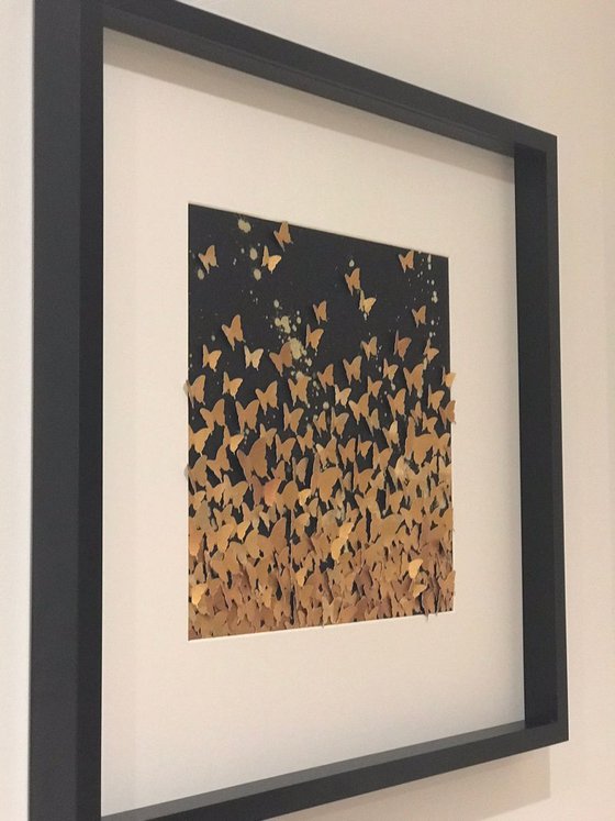 Butterfly swarm in gold