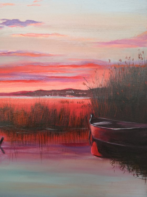 Sunset on the lake with boats landscape