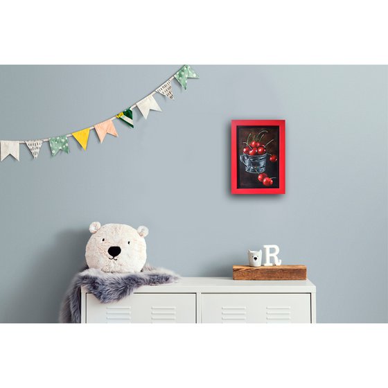 Red cherries in a metal cup