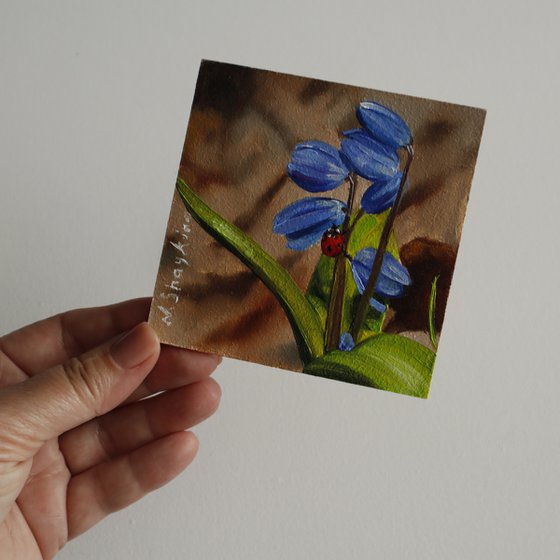 Blue Spring Flowers with Ladybug
