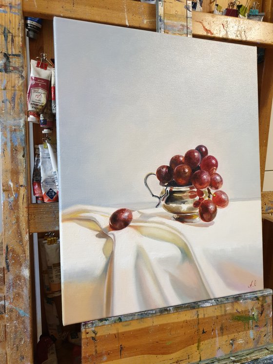 "Grapes in a silver bowl. "